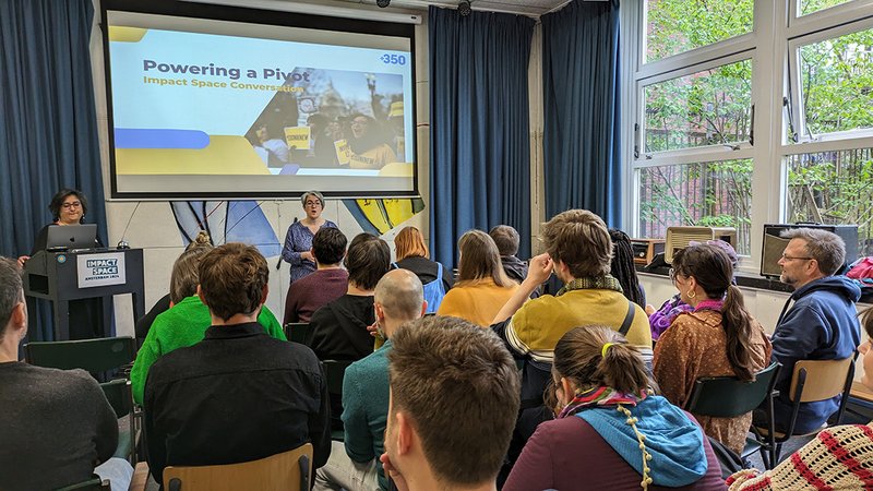 Participants sit and listen to a speaker